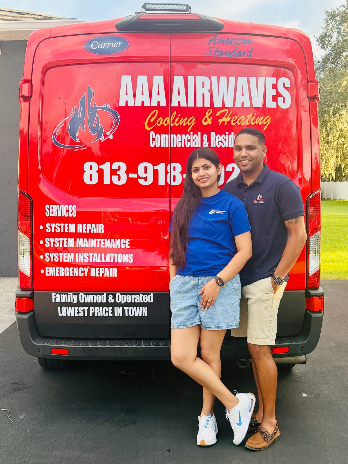 Amith Soney, owner of AAA Airwaves, and his wife in front of an AAA Airwaves service van